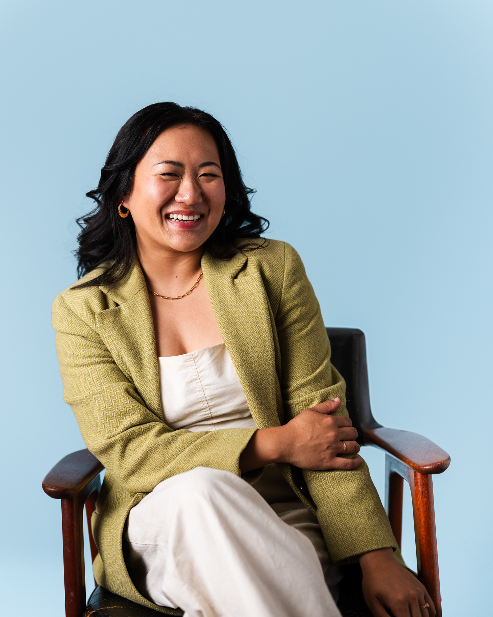 Vanessa Li smiling in a green blazer
